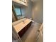 Bathroom with double vanity, large mirror, separate tub and shower, and plenty of natural light at 929 Wexford Way, Auburn, GA 30011