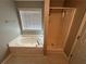 Bathroom featuring a jacuzzi tub under a window and separate shower stall at 929 Wexford Way, Auburn, GA 30011
