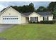 Charming one-story home with well-maintained lawn and a welcoming front entrance at 929 Wexford Way, Auburn, GA 30011