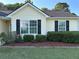 Charming home with a well-manicured lawn and mature bushes at 929 Wexford Way, Auburn, GA 30011