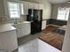 Kitchen with ample countertop space, modern appliances and stylish finishes at 929 Wexford Way, Auburn, GA 30011