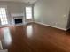 Spacious living room with wooden floors, fireplace, and natural light at 929 Wexford Way, Auburn, GA 30011
