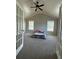 Large primary bedroom with vaulted ceiling, ceiling fan and french doors at 929 Wexford Way, Auburn, GA 30011
