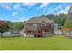 Large backyard with a deck, above-ground pool, and plenty of space for recreation and relaxation at 147 Midland Dr, Stockbridge, GA 30281