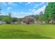 Spacious backyard with a deck, above-ground pool, and ample green space for outdoor activities at 147 Midland Dr, Stockbridge, GA 30281