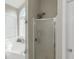 This bathroom features a tub, shower, and a window allowing natural light at 147 Midland Dr, Stockbridge, GA 30281