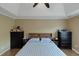 Relaxing bedroom featuring tray ceilings, hardwood floors, and stylish decor at 147 Midland Dr, Stockbridge, GA 30281