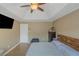 Comfortable bedroom featuring a tray ceiling, hardwood floors, and a calming ambiance at 147 Midland Dr, Stockbridge, GA 30281
