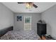 This bedroom is equipped with a ceiling fan and a dresser at 147 Midland Dr, Stockbridge, GA 30281