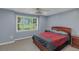 This bedroom is equipped with a ceiling fan and a dresser at 147 Midland Dr, Stockbridge, GA 30281