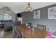 Dining area with wood table and view into the adjacent living room at 147 Midland Dr, Stockbridge, GA 30281