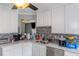Kitchen with white cabinets, light countertops and stainless steel appliances at 147 Midland Dr, Stockbridge, GA 30281