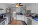 Bright kitchen features white cabinets and stainless steel appliances at 147 Midland Dr, Stockbridge, GA 30281