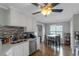 Open kitchen layout featuring a dining area, stainless steel appliances, and hardwood floors at 147 Midland Dr, Stockbridge, GA 30281