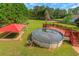 Backyard featuring an above-ground pool, deck, and shaded lounge area, perfect for summer relaxation at 147 Midland Dr, Stockbridge, GA 30281
