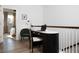 Cozy landing with a workstation featuring a dark desk, chair, and view of a bedroom at 1598 Driggs Nw Dr # 163, Atlanta, GA 30318