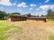 Home backyard with a mix of grass and dirt at 1710 Fontaine Dr, Jonesboro, GA 30236