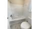 Bathroom featuring a white tub with white tile surround at 1710 Fontaine Dr, Jonesboro, GA 30236