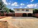 Two-story home with a brick foundation and white siding above at 1710 Fontaine Dr, Jonesboro, GA 30236