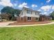 Charming two-story home with a brick exterior and well-manicured front lawn at 1710 Fontaine Dr, Jonesboro, GA 30236