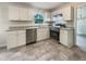 Modern kitchen featuring white cabinets, stainless steel appliances, and granite countertops at 1710 Fontaine Dr, Jonesboro, GA 30236