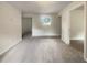 A spacious living room with neutral paint and carpet, and natural light from the window at 1710 Fontaine Dr, Jonesboro, GA 30236