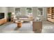 Bright living room with white sofas, striped rug, and arched windows offering an airy and modern aesthetic at 1710 Fontaine Dr, Jonesboro, GA 30236