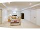 Finished basement area with a comfortable sofa, a coffee table, and ample lighting at 1764 Defoor Nw Ave, Atlanta, GA 30318