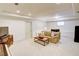 Finished basement features a comfortable sofa, a coffee table, and additional space for activities at 1764 Defoor Nw Ave, Atlanta, GA 30318