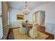 Elegant dining room with hardwood floors, wainscoting, and a chandelier at 1764 Defoor Nw Ave, Atlanta, GA 30318