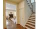 Grand foyer with hardwood floors, staircase, and a view of the living room with fireplace at 1764 Defoor Nw Ave, Atlanta, GA 30318