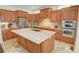 Kitchen with stainless steel appliances, custom cabinets, and oversized island at 1764 Defoor Nw Ave, Atlanta, GA 30318