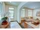 Inviting living room features an open floor plan, hardwood floors, and plantation shutters for bright natural light at 1764 Defoor Nw Ave, Atlanta, GA 30318