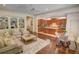 Open-concept living room with access to the kitchen and a built-in bookshelf at 1764 Defoor Nw Ave, Atlanta, GA 30318