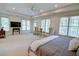Bright main bedroom featuring a sitting area, large windows, and ample space at 1764 Defoor Nw Ave, Atlanta, GA 30318