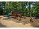 A community playground is complete with slides, climbing equipment, and a soft landing with wood chip ground cover at 1764 Defoor Nw Ave, Atlanta, GA 30318