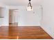 Dining area featuring hardwood floors and modern lighting fixture at 2870 Pharr Court South Nw # 1405, Atlanta, GA 30305