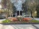 Apartment building entrance featuring lush landscaping and water fountain at 2870 Pharr Court South Nw # 1405, Atlanta, GA 30305