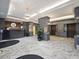 Building lobby featuring marble floors, modern decor, elevator access and concierge desk at 2870 Pharr Court South Nw # 1405, Atlanta, GA 30305