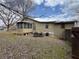 Image showcasing back of home with screened in porch at 3143 Cedar St, Scottdale, GA 30079