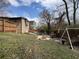 Large backyard with a fenced yard and mature trees at 3143 Cedar St, Scottdale, GA 30079