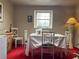 Elegant dining room with carpet, and a bright window at 3143 Cedar St, Scottdale, GA 30079