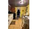 Cozy eat-in kitchen featuring white cabinets, natural light, and a dining area at 3143 Cedar St, Scottdale, GA 30079