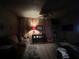 Cozy living room with carpet and wood paneling at 3143 Cedar St, Scottdale, GA 30079