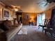 Living room with plush sofa, carpet, and natural lighting at 3143 Cedar St, Scottdale, GA 30079