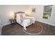 Cozy bedroom featuring wood flooring, a queen-sized bed, and ample natural light at 550 Quillian Ave, Decatur, GA 30032