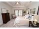 A bright main bedroom with a trey ceiling, four-post bed and large windows with natural light at 550 Quillian Ave, Decatur, GA 30032