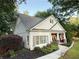 Well-maintained home with beautiful landscaping, stone accents, and a welcoming front porch with an American flag at 550 Quillian Ave, Decatur, GA 30032
