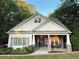 Charming craftsman-style home with a welcoming stone porch and beautiful landscaping at 550 Quillian Ave, Decatur, GA 30032