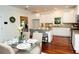 Eat-in kitchen featuring white cabinetry, granite countertops, and hardwood floors at 550 Quillian Ave, Decatur, GA 30032